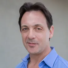 Man wearing blue collar shirt.